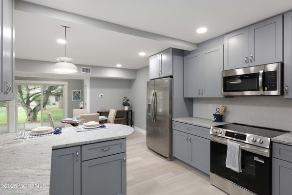 Dining room, Interior, Kitchen, Pendant Lights, Recessed Lighting, Stainless Steel Appliances, Wood Texture Flooring