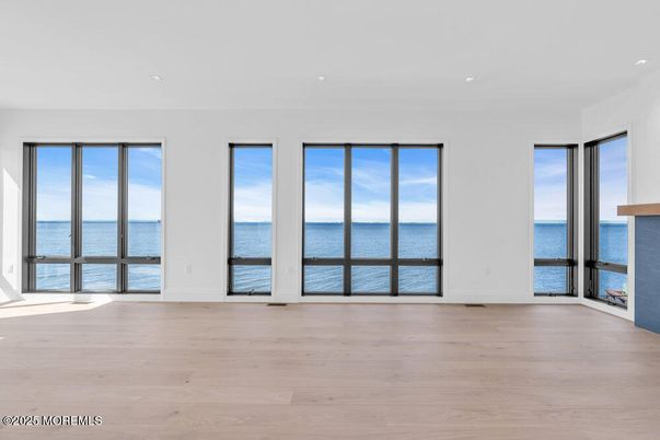 Empty room, Fireplace, Interior, Recessed Lighting, Water, Wood Texture Flooring