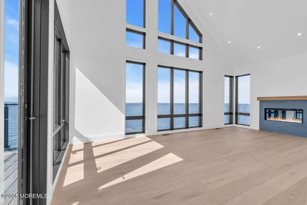 Empty room, Fireplace, Interior, Recessed Lighting, Water, Wood Texture Flooring