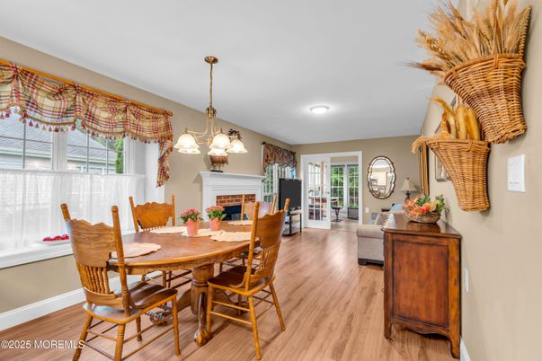 Dining room, Fireplace, Interior, Living room, Pendant Lights, Recessed Lighting, Wood Texture Flooring