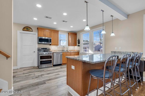 Interior, Kitchen, Pendant Lights, Recessed Lighting, Stainless Steel Appliances, Wood Texture Flooring