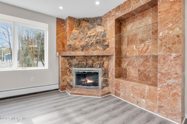 Fireplace, Interior, Recessed Lighting, Stone Walls, Wood Texture Flooring