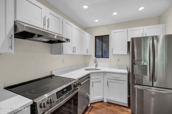 Interior, Kitchen, Recessed Lighting, Stainless Steel Appliances, Wood Texture Flooring