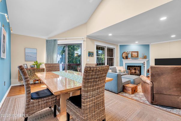 Dining room, Fireplace, Interior, Living room, Recessed Lighting, Wood Texture Flooring