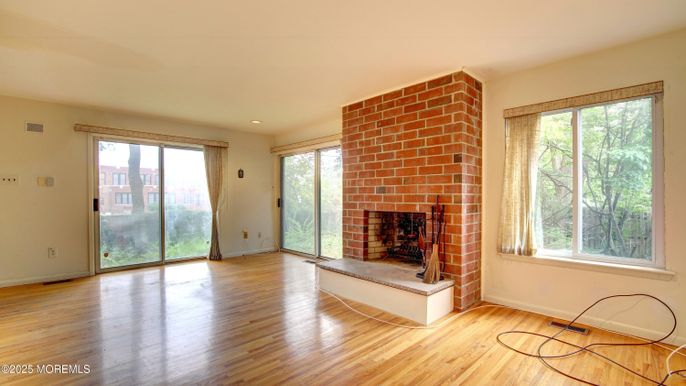 Empty room, Fireplace, Interior, Recessed Lighting, Stone Walls, Wood Texture Flooring