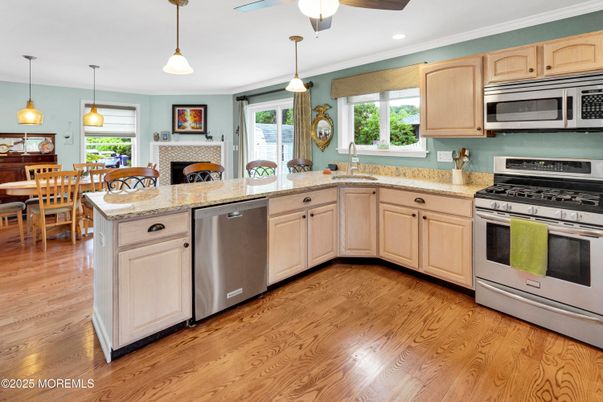 Dining room, Fireplace, Interior, Kitchen, Pendant Lights, Recessed Lighting, Stainless Steel Appliances, Wood Texture Flooring