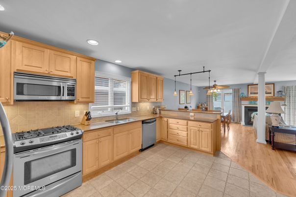 Dining room, Interior, Kitchen, Pendant Lights, Recessed Lighting, Stainless Steel Appliances, Wood Texture Flooring