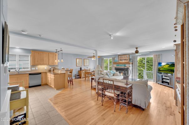Dining room, Fireplace, Interior, Kitchen, Living room, Pendant Lights, Recessed Lighting, Stainless Steel Appliances, Wood Texture Flooring