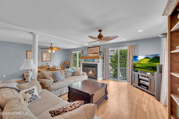 Dining room, Fireplace, Interior, Living room, Recessed Lighting, Wood Texture Flooring