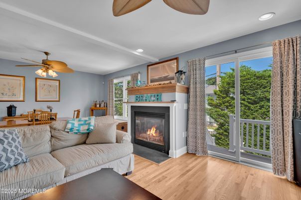 Dining room, Fireplace, Interior, Living room, Recessed Lighting, Wood Texture Flooring