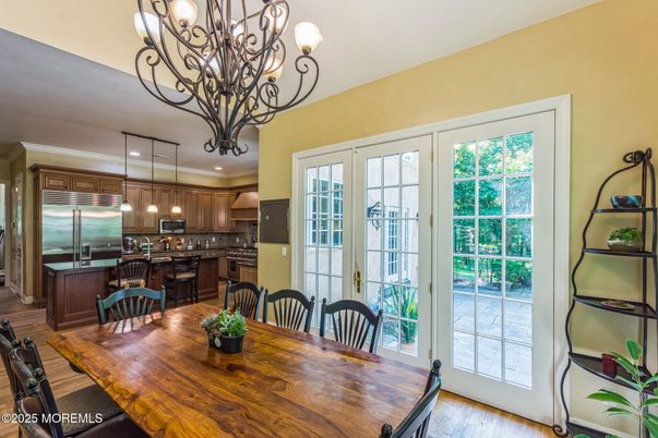 Chandelier, Dining room, Interior, Kitchen, Pendant Lights, Recessed Lighting, Stainless Steel Appliances, Wood Texture Flooring