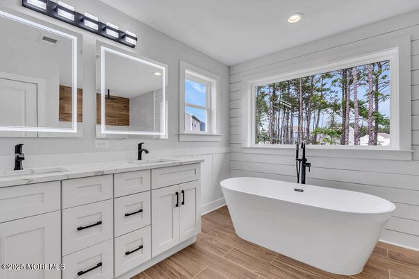 Bathroom, Dual Sink Vanities, Free Standing Baths, Interior, Recessed Lighting, Wood Texture Flooring
