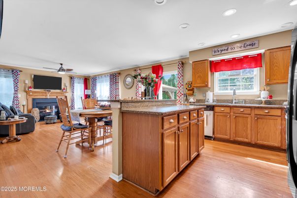 Dining room, Fireplace, Interior, Kitchen, Recessed Lighting, Wood Texture Flooring