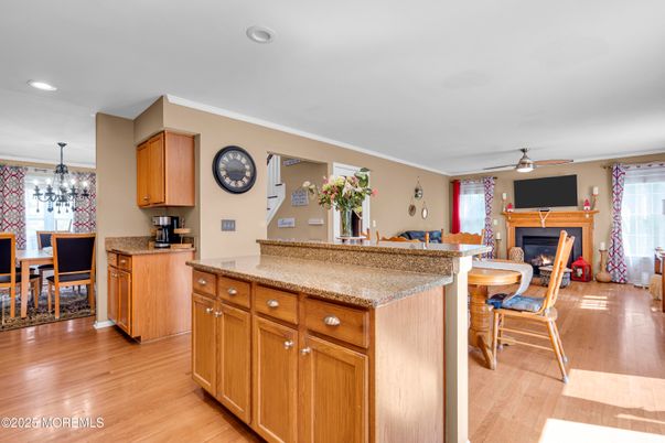 Chandelier, Dining room, Fireplace, Interior, Recessed Lighting, Wood Texture Flooring