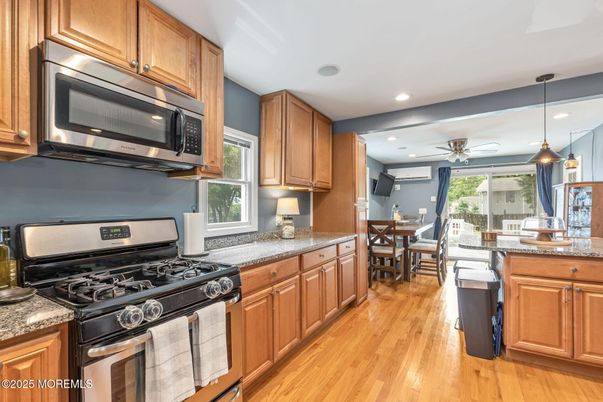 Dining room, Interior, Kitchen, Pendant Lights, Recessed Lighting, Stainless Steel Appliances, Wood Texture Flooring