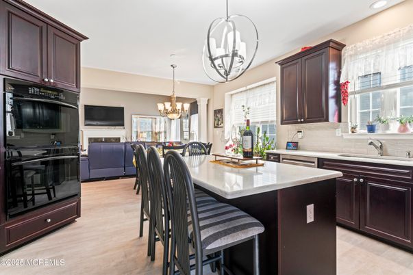 Chandelier, Dining room, Interior, Kitchen, Living room, Pendant Lights, Recessed Lighting, Wood Texture Flooring