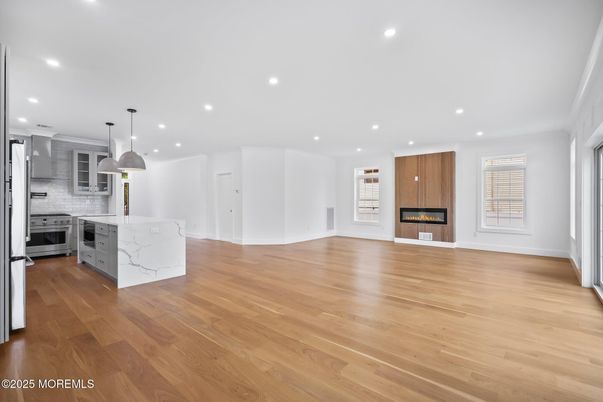 Fireplace, Interior, Kitchen, Pendant Lights, Recessed Lighting, Stainless Steel Appliances, Wood Texture Flooring
