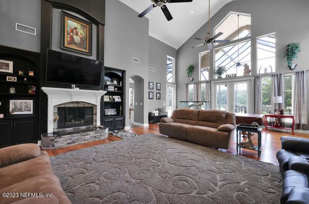 Fireplace, Interior, Living room, Recessed Lighting, Stone Walls, Wood Texture Flooring