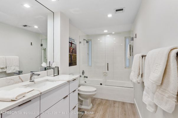 Bathroom, Dual Sink Vanities, Glass Shower, Interior, Recessed Lighting, Wood Texture Flooring