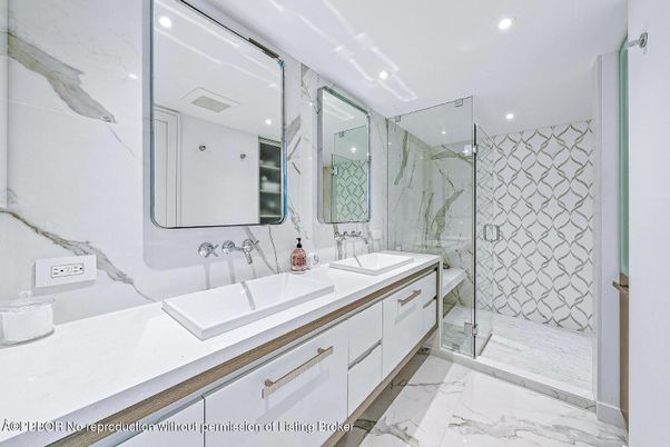 Bathroom, Dual Sink Vanities, Glass Shower, Interior, Marble, Marble Walls, Recessed Lighting