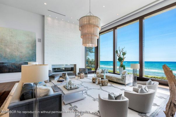 Chandelier, Fireplace, Interior, Living room, Recessed Lighting, Water, Wood Texture Flooring