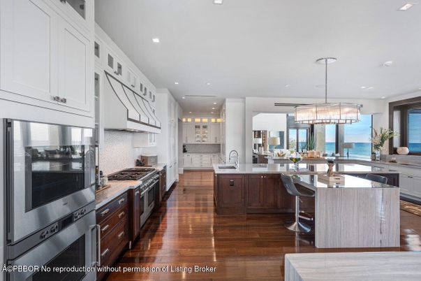 Chandelier, Dining room, Interior, Kitchen, Pendant Lights, Recessed Lighting, Stainless Steel Appliances, Water, Wood Texture Flooring