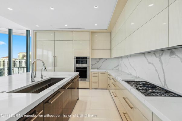 Interior, Kitchen, Marble Walls, Recessed Lighting, Stainless Steel Appliances