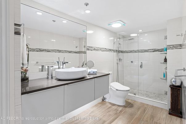 Bathroom, Dual Sink Vanities, Glass Shower, Interior, Recessed Lighting, Wood Texture Flooring