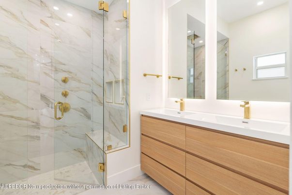 Bathroom, Dual Sink Vanities, Glass Shower, Interior, Marble Walls, Recessed Lighting