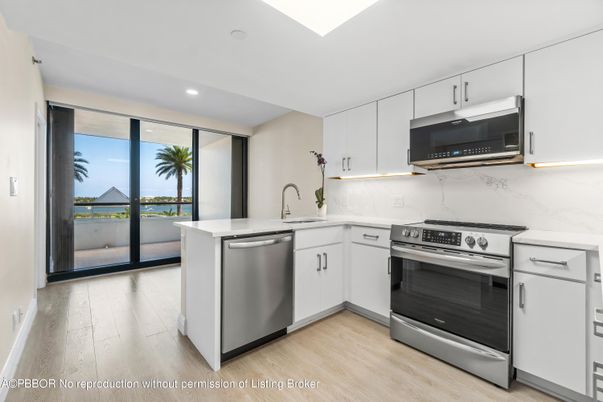 Interior, Kitchen, Marble Walls, Recessed Lighting, Stainless Steel Appliances, Wood Texture Flooring
