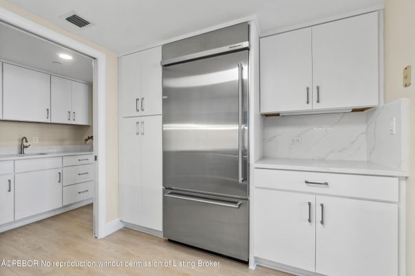 Interior, Kitchen, Marble Walls, Recessed Lighting, Stainless Steel Appliances, Wood Texture Flooring