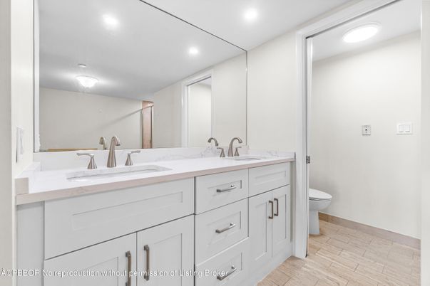 Bathroom, Dual Sink Vanities, Interior, Recessed Lighting, Wood Texture Flooring