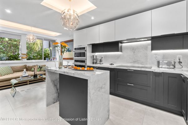 Interior, Kitchen, Marble Walls, Pendant Lights, Recessed Lighting, Stainless Steel Appliances