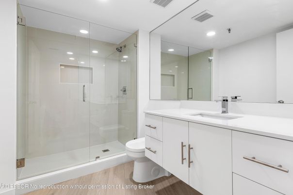 Bathroom, Dual Sink Vanities, Glass Shower, Interior, Recessed Lighting, Wood Texture Flooring
