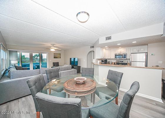 Dining room, Interior, Kitchen, Living room, Recessed Lighting, Stainless Steel Appliances, Wood Texture Flooring