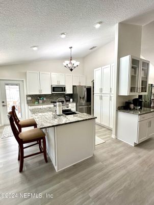 Chandelier, Interior, Kitchen, Recessed Lighting, Stainless Steel Appliances, Wood Texture Flooring
