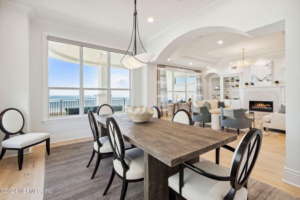 Chandelier, Dining room, Fireplace, Interior, Living room, Pendant Lights, Recessed Lighting, Wood Texture Flooring