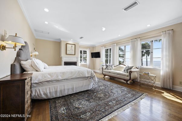 Bedroom, Fireplace, Interior, Recessed Lighting, Water, Wood Texture Flooring