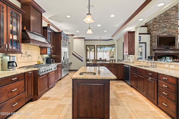 Fireplace, Interior, Kitchen, Pendant Lights, Recessed Lighting, Stainless Steel Appliances, Stone Walls