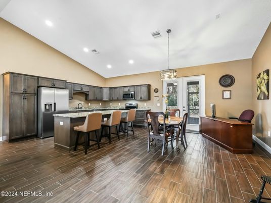 Dining room, Interior, Kitchen, Pendant Lights, Recessed Lighting, Stainless Steel Appliances, Wood Texture Flooring