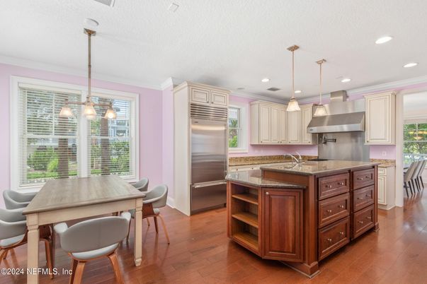 Dining room, Interior, Kitchen, Pendant Lights, Recessed Lighting, Stainless Steel Appliances, Wood Texture Flooring
