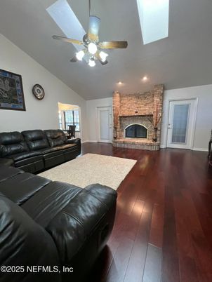Fireplace, Interior, Living room, Recessed Lighting, Stone Walls, Wood Texture Flooring