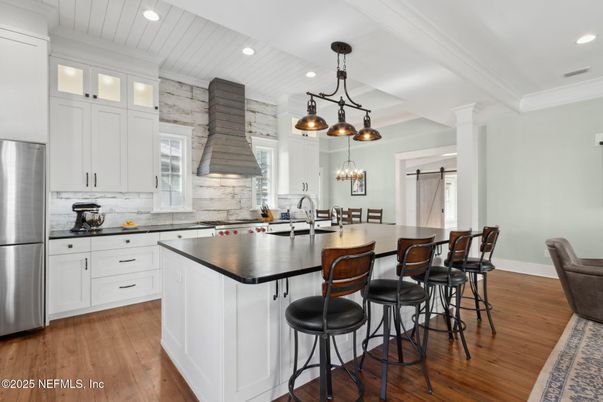 Dining room, Interior, Kitchen, Pendant Lights, Recessed Lighting, Stainless Steel Appliances, Wood Texture Flooring