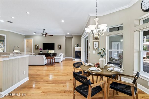 Chandelier, Dining room, Fireplace, Interior, Living room, Recessed Lighting, Wood Texture Flooring