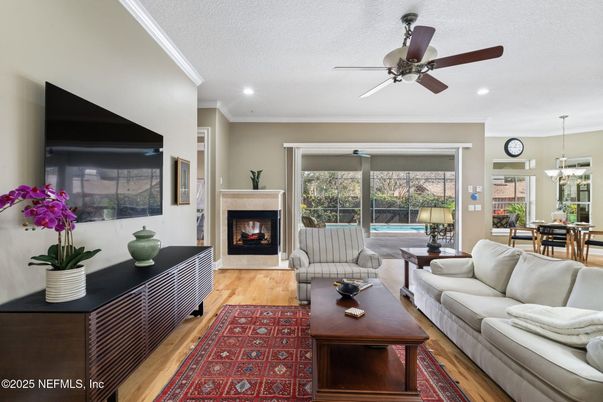Dining room, Fireplace, Interior, Living room, Recessed Lighting, Wood Texture Flooring