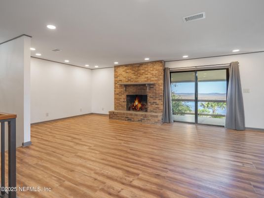 Empty room, Fireplace, Interior, Recessed Lighting, Stone Walls, Wood Texture Flooring