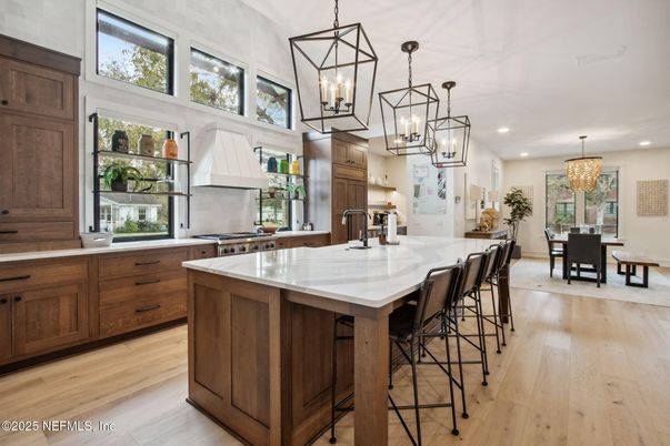 Chandelier, Dining room, Interior, Kitchen, Pendant Lights, Recessed Lighting, Stainless Steel Appliances, Wood Texture Flooring