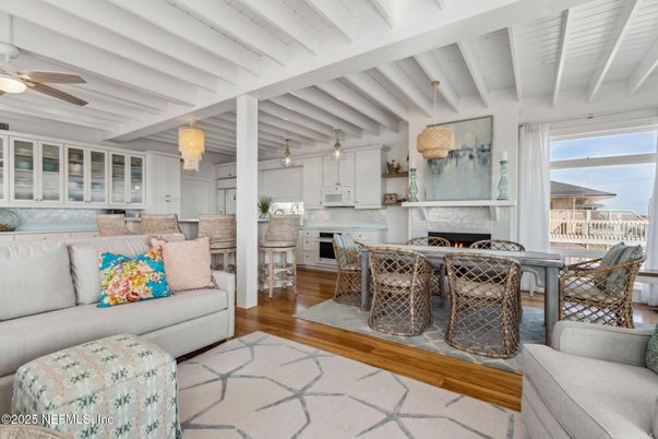 Chandelier, Dining room, Fireplace, Interior, Kitchen, Living room, Pendant Lights, Stainless Steel Appliances, Wood Texture Flooring