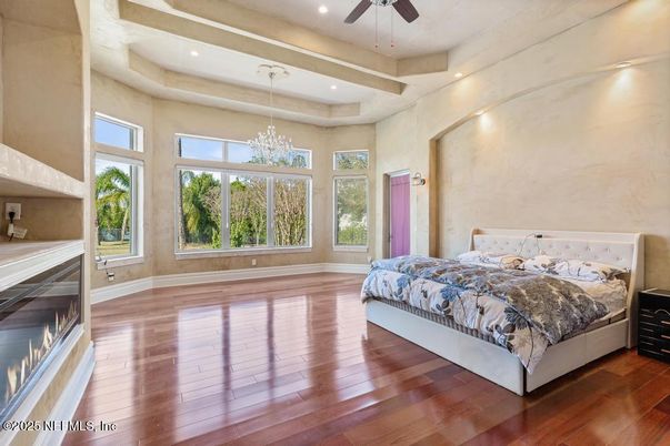 Bedroom, Chandelier, Fireplace, Interior, Recessed Lighting, Wood Texture Flooring