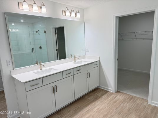 Bathroom, Dual Sink Vanities, Glass Shower, Interior, Walk-in Closets, Wood Texture Flooring